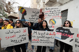 26storie-f01-people-shout-slogans-during-a-protest-against-tunisian-president-kais-saied-after-his-statement-against-african-migrants-saying-their-presence-was-a-source-of-violence-an