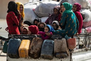 On 11 October 2019 in the Syrian Arab Republic, women and children are transported on the back of a truck as families displaced from Ras Al-ain arrive in Tal Tamer, 75km southeast Ras of Al-ain, having fled escalating violence. In early October 2019, as violence escalates in northeast Syria, many children are at imminent risk of injury, death and displacement. of Ras al-Ain and Tal Abiad. Since the start of the hostilities on 9 October 2019, an estimated 130,000 people have fled from areas around Tal Abiad and Ras Al-ain. Most of the 18,000 people living in Tal Abiad town and 11,000 people living in Ras Al-ain have reportedly fled towards Tal Tamer and Hasakeh City. While most of the displaced are being hosted in the local communities with relatives, some have sought refuge in collective shelters in schools and unfinished buildings. An estimated 33 collective shelters have been identified. In Tal Tamer, 18 schools are hosting an increasing number of IDPs. While significant further displacements continue, UNICEF?s partners have started providing emergency assistance to families arriving at collective shelters in Hassakeh city and Tal Tamar.