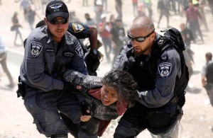 israeli-policemen-detain-a-palestinian-girl-in-khan-al-ahmar-west-bank-on-4-july-2018-reuters